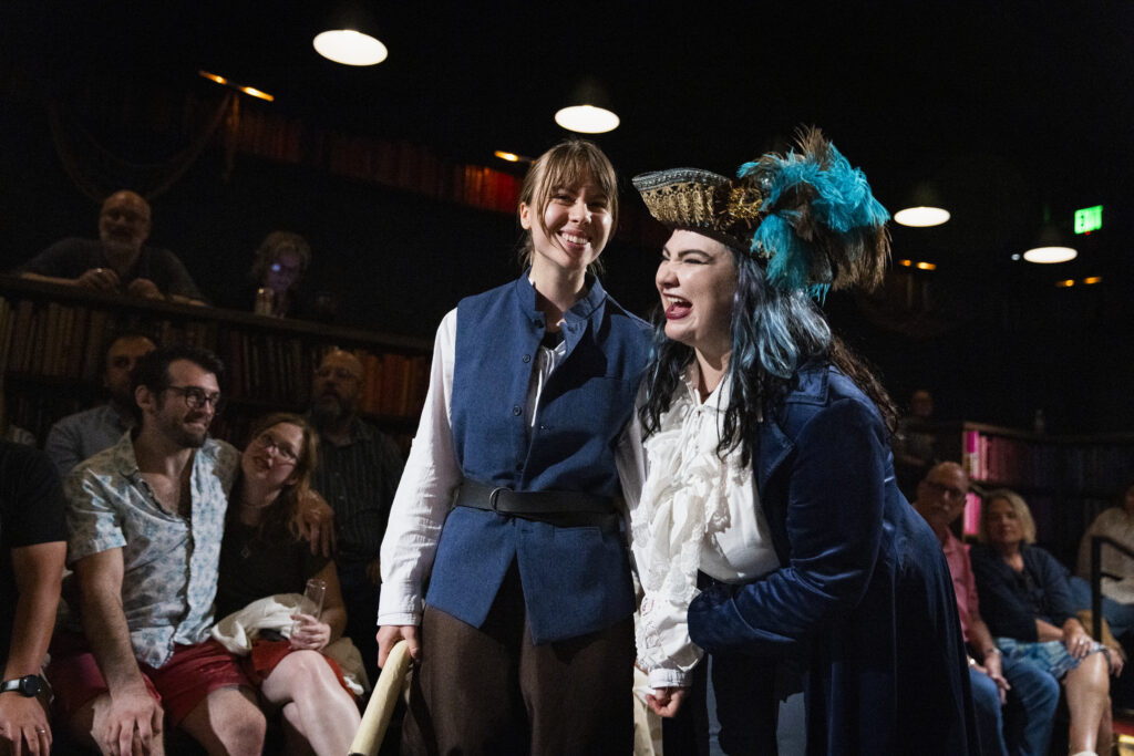 The Cast of Drunk Pirates sharing a moment on stage